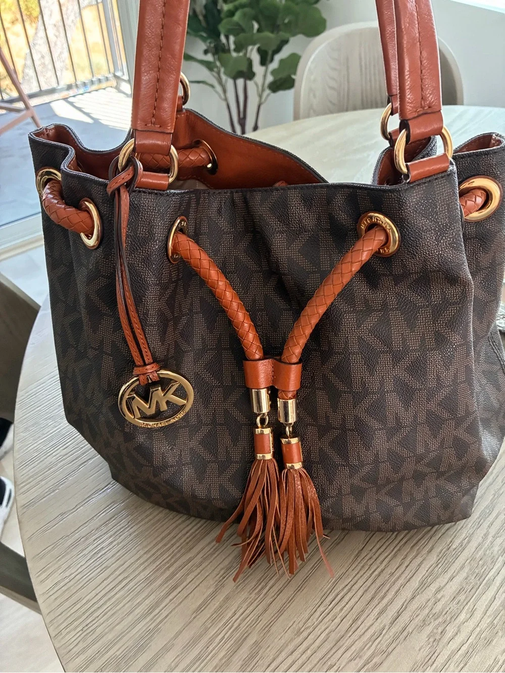 Michael Kors Brown MK Monogram Drawstring Shoulder Bag with Tan Accents